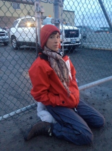 Alyssa Symons-Bélanger with her neck locked to the gate of a Suncor oil refinery in Montreal. Photo: Aaron Lakoff.